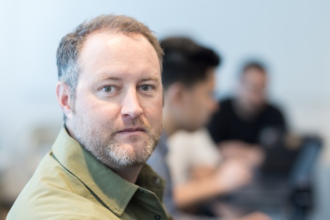 man listening in meeting
