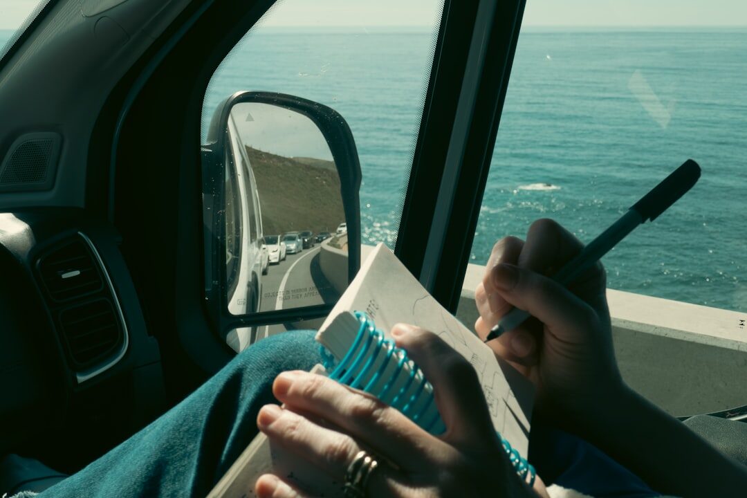 woman writing notes in journal
