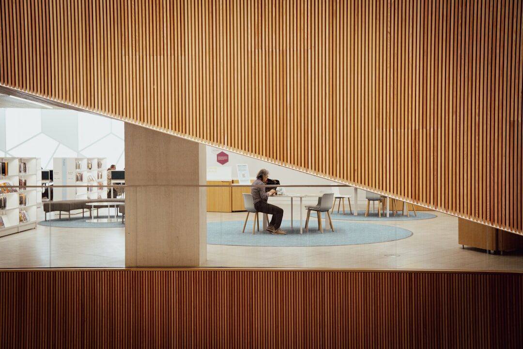 person reading book in quiet room
